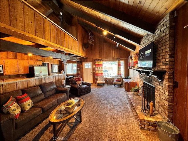 living room with wood walls, a fireplace, wood ceiling, beam ceiling, and carpet