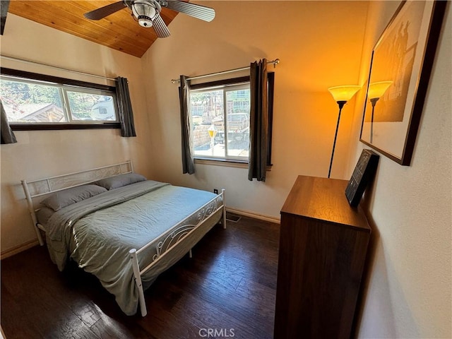 bedroom featuring wooden ceiling, vaulted ceiling, baseboards, and wood finished floors