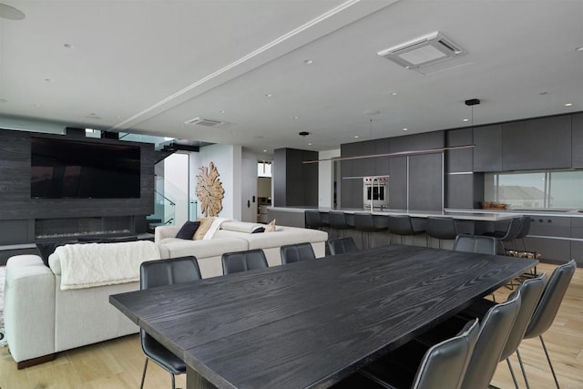 dining area with light hardwood / wood-style flooring