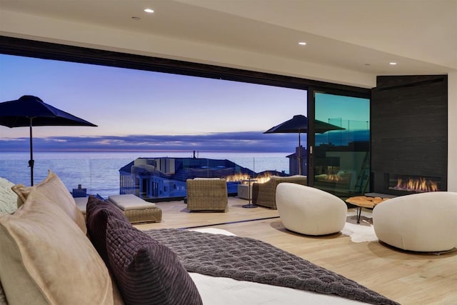 interior space with a water view and an outdoor hangout area