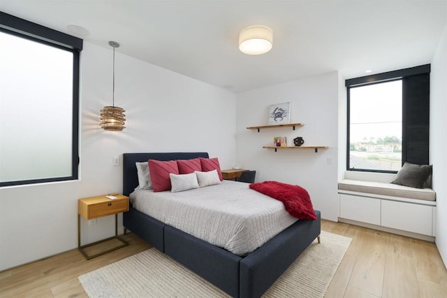 bedroom with light hardwood / wood-style flooring