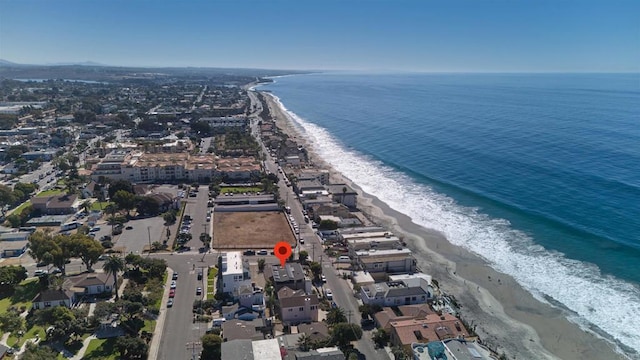 aerial view with a water view and a beach view