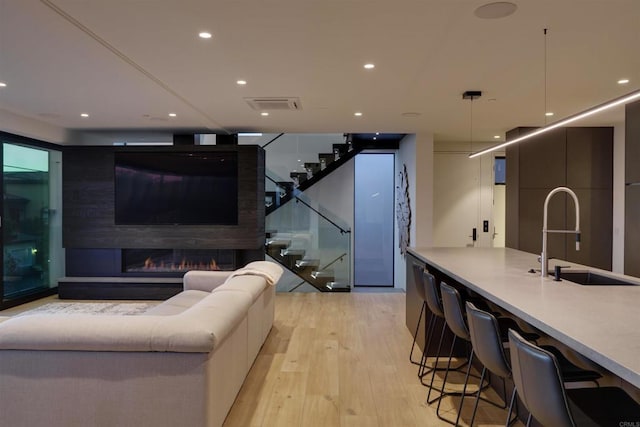 interior space featuring sink and light hardwood / wood-style floors