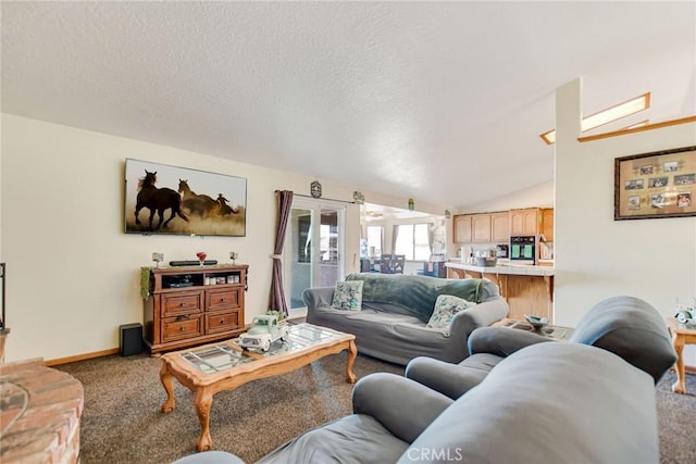 living room with carpet floors, vaulted ceiling, a textured ceiling, and baseboards