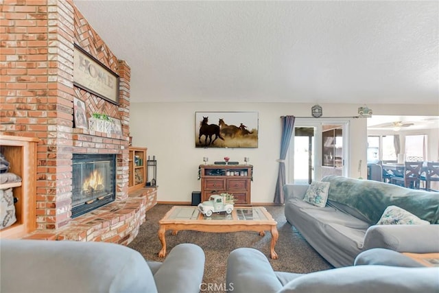 living room with a brick fireplace, a textured ceiling, baseboards, and carpet flooring