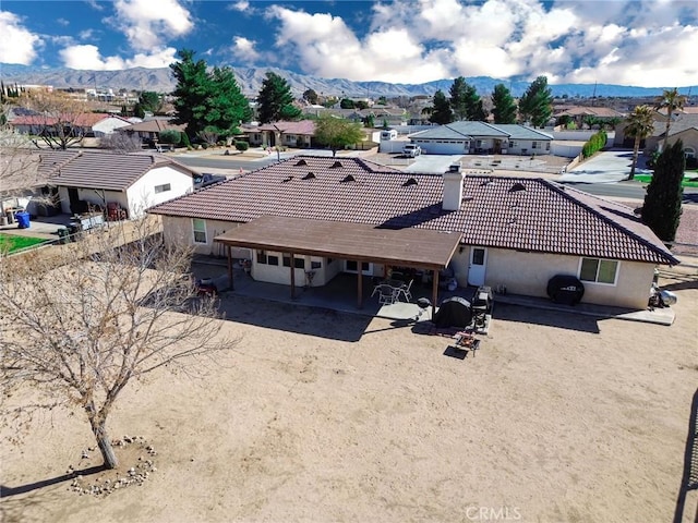 drone / aerial view featuring a residential view and a mountain view