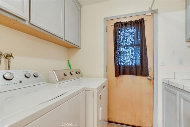 laundry room with washer and dryer and cabinet space