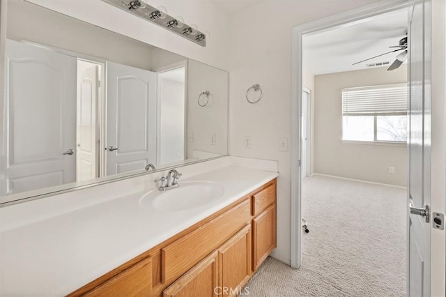 bathroom featuring a ceiling fan, visible vents, and vanity