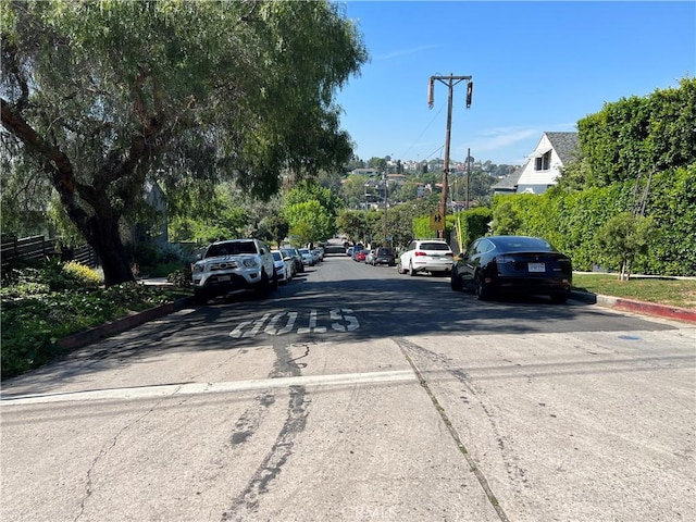 view of street with curbs