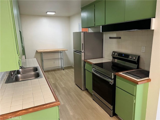 2929 Waverly Dr Unit 213, Los Angeles, CA 90039 - kitchen featuring appliances with stainless steel finishes, green cabinets, and tile counters