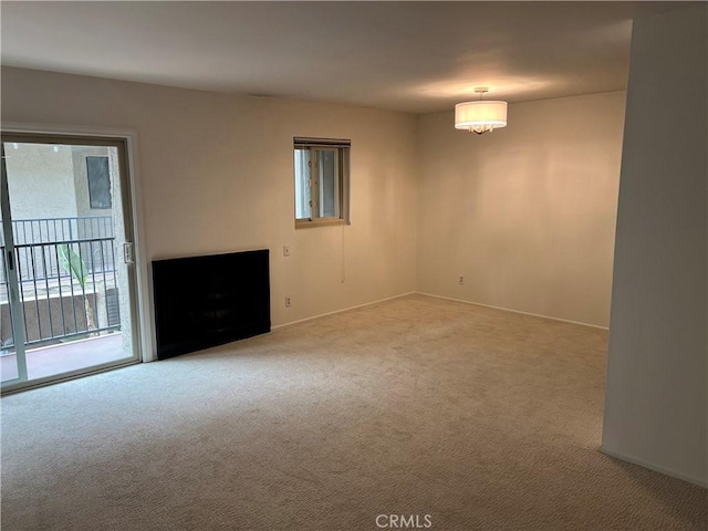 unfurnished room with baseboards and carpet floors