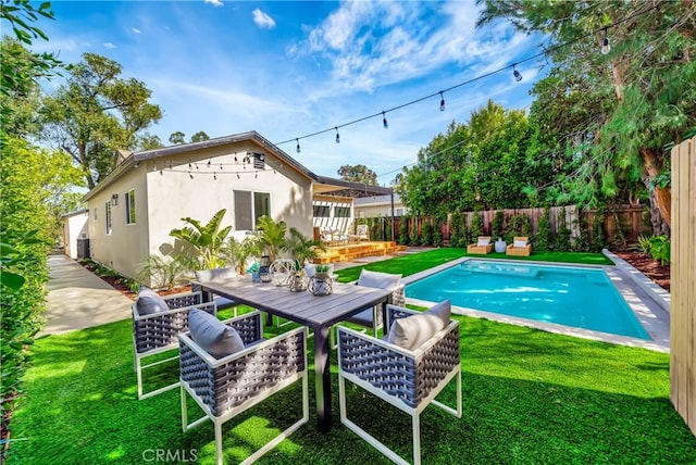 view of pool featuring a fenced backyard, a fenced in pool, and a yard