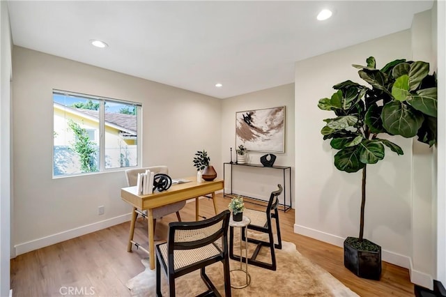 office area with light wood-type flooring, baseboards, and recessed lighting