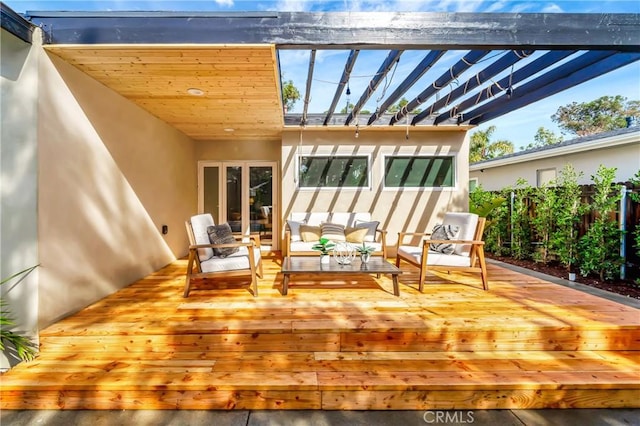 deck featuring fence, an outdoor hangout area, and a pergola