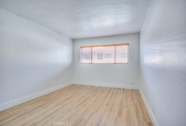 unfurnished room with light hardwood / wood-style flooring