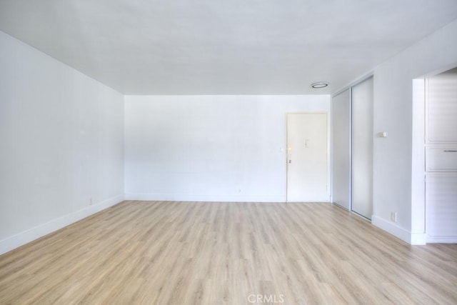 unfurnished room featuring light wood-type flooring