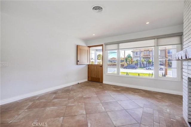 spare room with light tile patterned floors