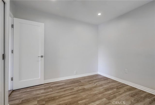 spare room featuring light hardwood / wood-style floors