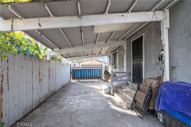 view of patio featuring fence