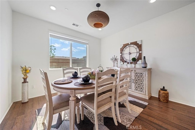 dining room featuring dark hardwood / wood-style flooring