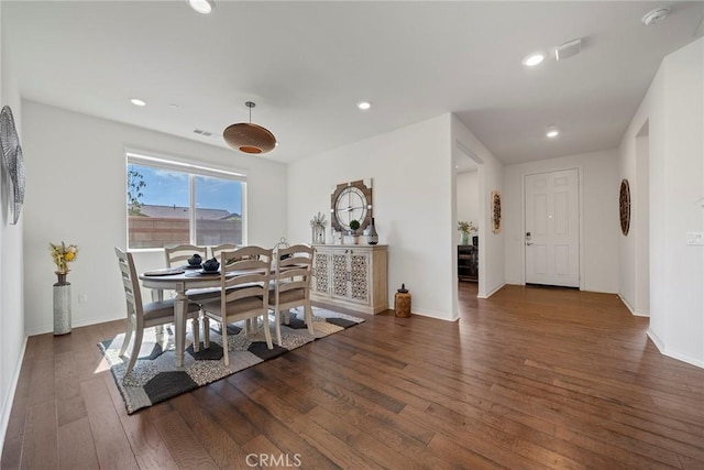 dining area with dark wood-type flooring