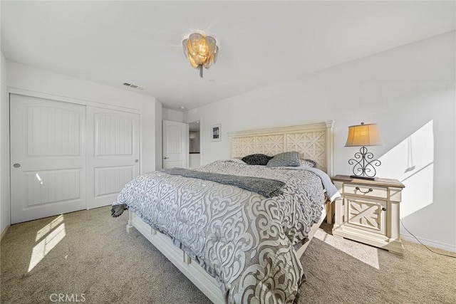 carpeted bedroom with a closet