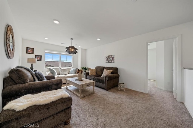 living room with light carpet and a notable chandelier