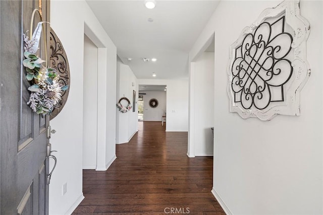 hallway featuring dark wood-type flooring