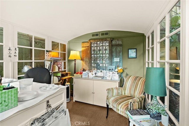 sunroom / solarium featuring vaulted ceiling