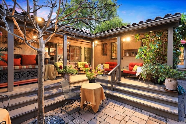 exterior space with a deck and an outdoor hangout area