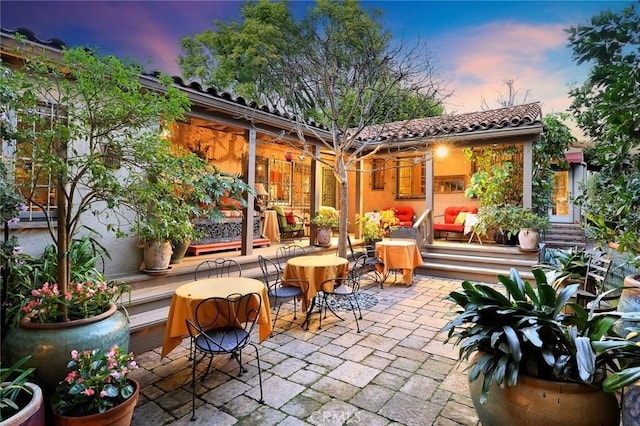 view of patio terrace at dusk