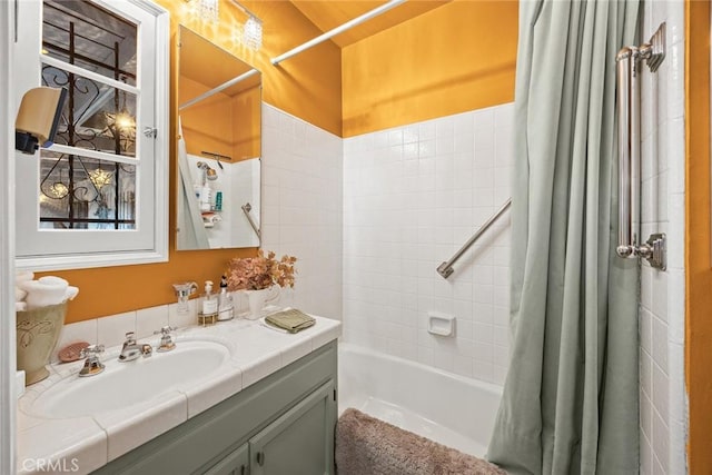 full bathroom featuring vanity and shower / bath combo with shower curtain