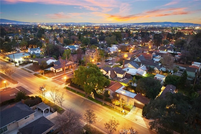 aerial view at dusk with a residential view and a mountain view