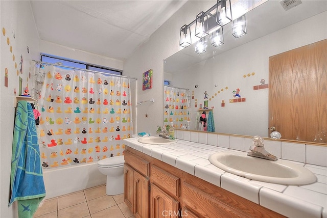 full bathroom with tile patterned floors, vanity, toilet, and shower / tub combo