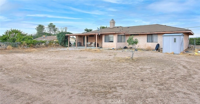 back of property with a patio area