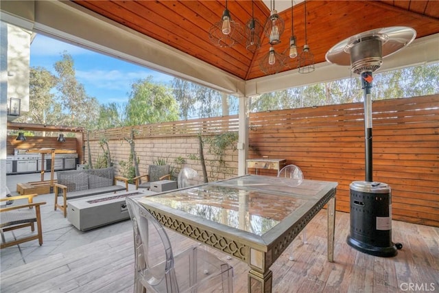 view of patio with ceiling fan, an outdoor fire pit, and a gazebo