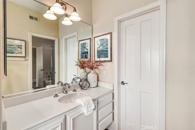 bathroom featuring visible vents and vanity