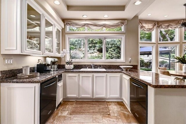kitchen featuring recessed lighting, a sink, white cabinetry, and dishwasher