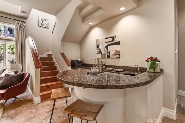bar featuring a sink, baseboards, stairway, indoor wet bar, and recessed lighting