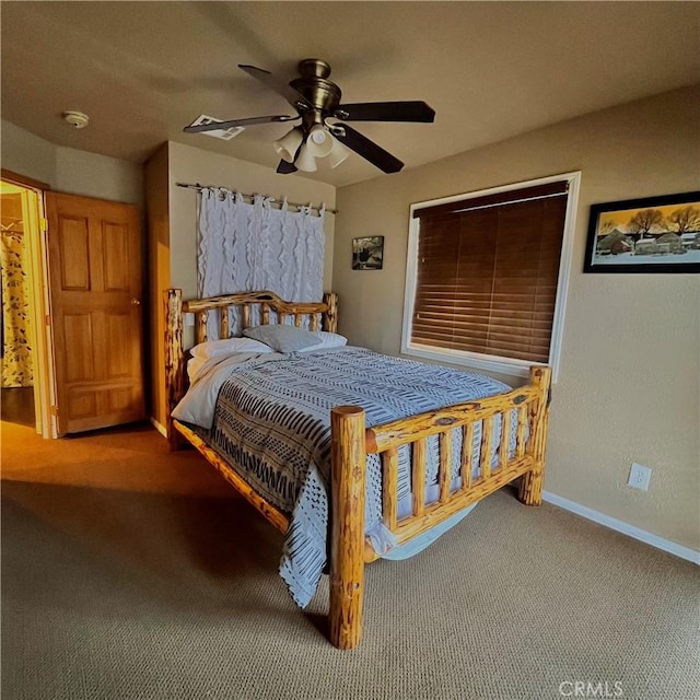 carpeted bedroom with baseboards and a ceiling fan