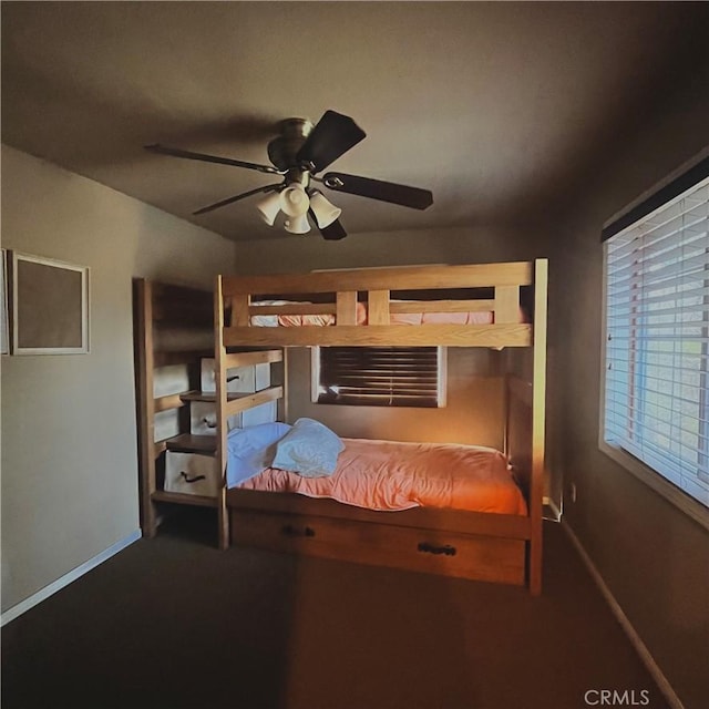 bedroom with carpet floors and baseboards