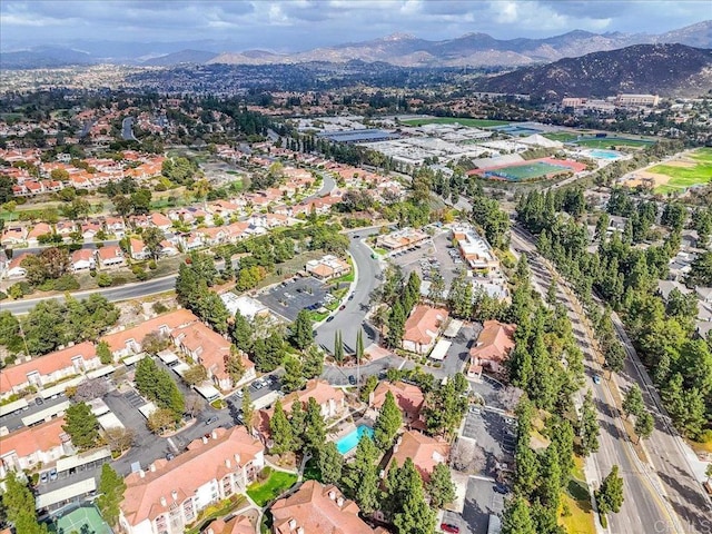 birds eye view of property with a mountain view