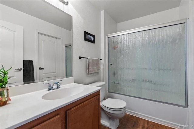 12059 Alta Carmel Ct Unit 167, San Diego, CA 92128 - bathroom featuring wood finished floors, vanity, toilet, and enclosed tub / shower combo