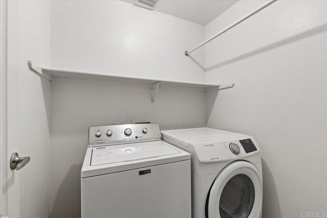 12059 Alta Carmel Ct Unit 167, San Diego, CA 92128 - laundry area with independent washer and dryer