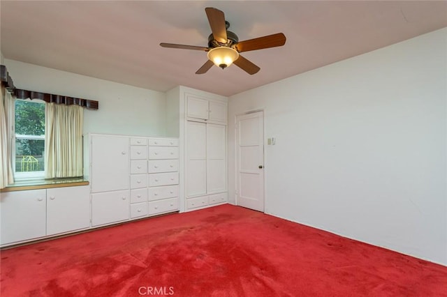 unfurnished bedroom with ceiling fan and carpet flooring