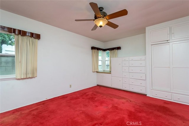 unfurnished bedroom with ceiling fan and carpet floors