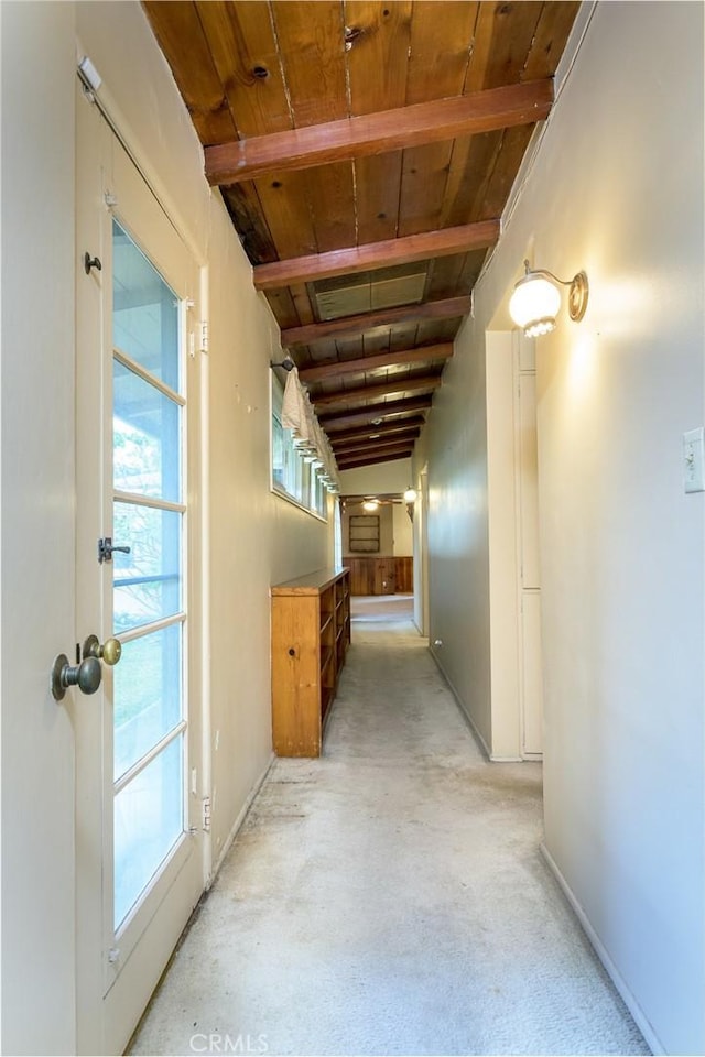 hall with beam ceiling and wooden ceiling