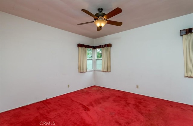 spare room with ceiling fan and carpet flooring