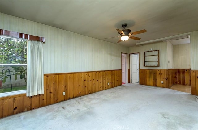 carpeted empty room with ceiling fan