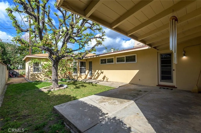 exterior space featuring a yard and a patio